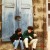 Couple sitting on steps to grab a bite to eat in Rothenburg. Couple sitting on steps to grab a bite to eat in Rothenburg.