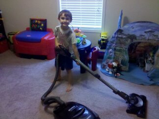 My proof that a 6 year can vacuum with a smile!