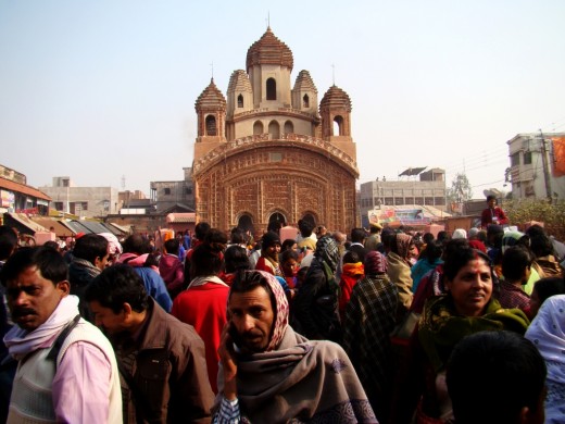 Crowd with Radha Vinod temple in the background