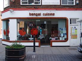 The Bengal Cuisine at No 12. Unsuspecting tourists beware, you could be sitting in a dead girl's seat if you choose the No 13 curry house instead. Creepy!