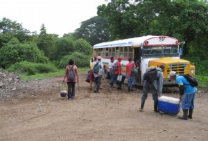 the workers arrive in their bus
