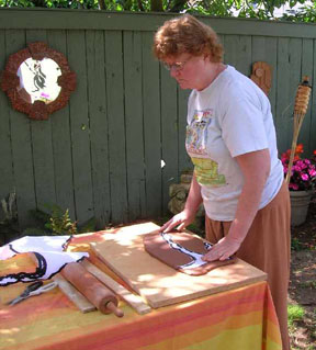 Patti cutting the tree pieces