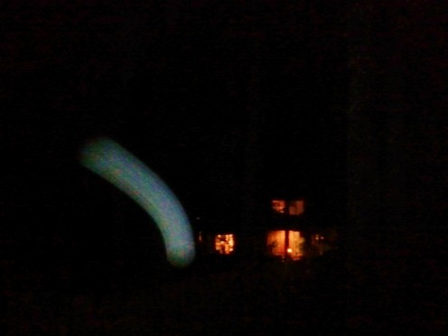 Moving orb captured at dusk through the single lense of a cell phone camera.
