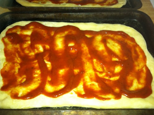 Spread pizza sauce on lightly cooked dough to avoid a soggy crust.