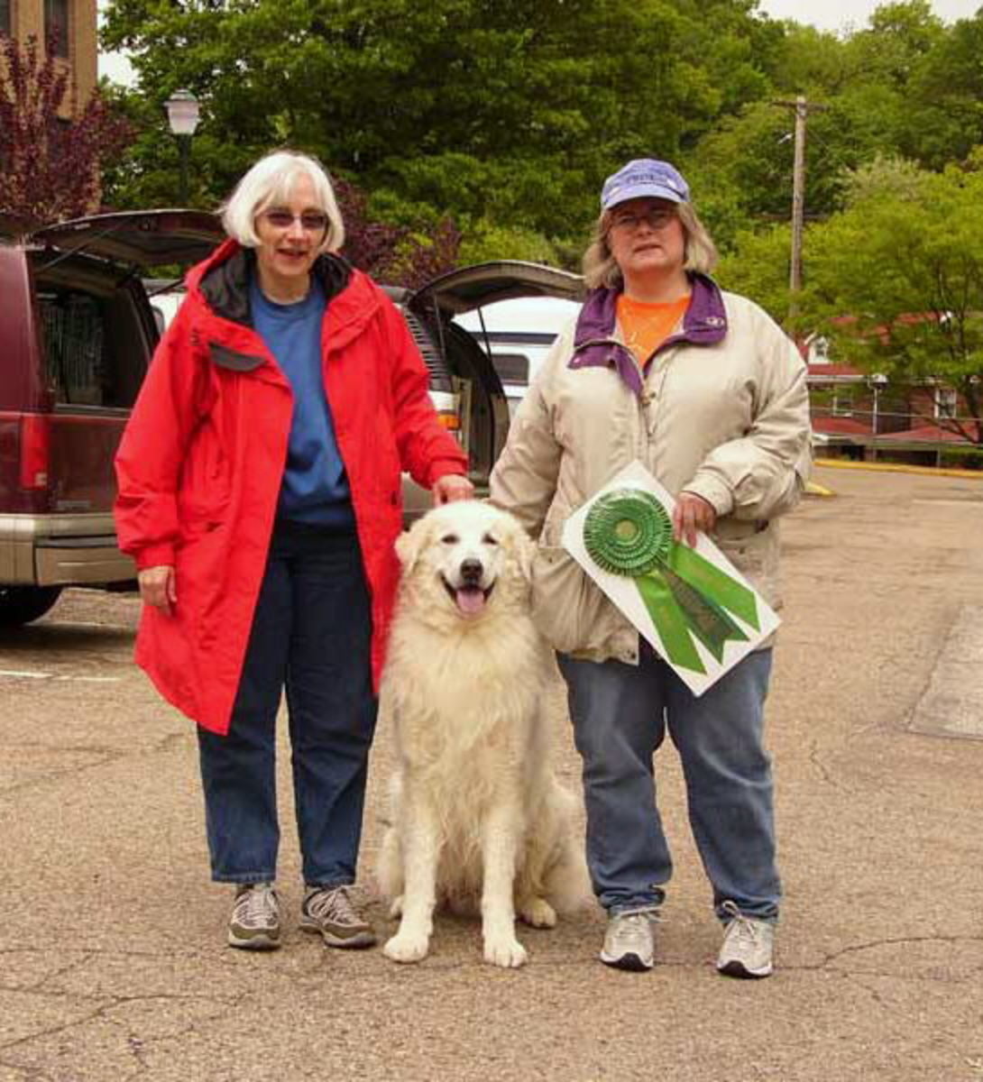 Dahmer with her Beamer with a TDX title. This picture was given by late Olga Schmidt of Brantwood Kuvasz.