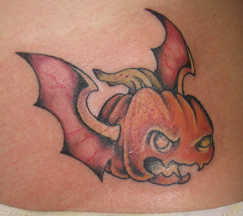 pumpkin tattoo with bat wings