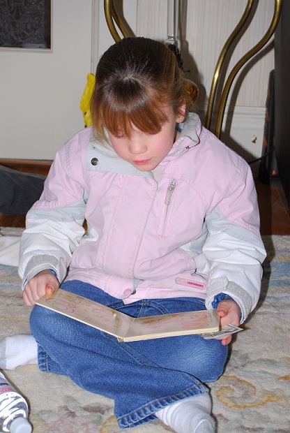 young girl enjoying reading