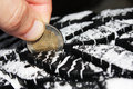 This picture shows measuring tread with a Euro-coin. A penny can be used as well. 