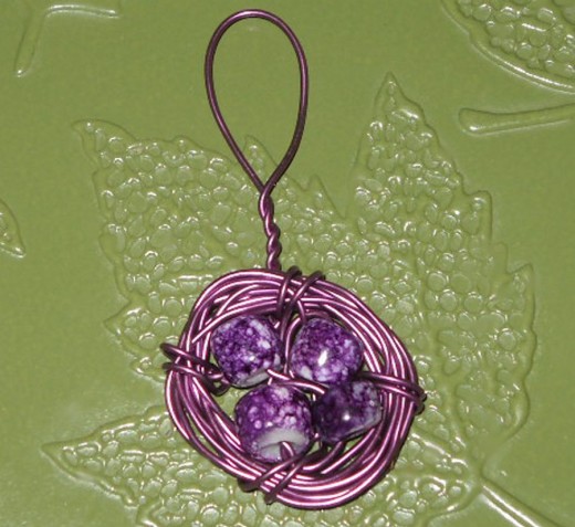 twist wire to desired loop size securing loose end on back as instructed