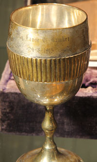 This goblet was awarded by King George V to the first British ace, Lanoe Hawker.  Hawker was shot down by Manfred von Richthofen, and in the background of this picture is the Bible he carried with him, which the Red Baron took as a souvenir.