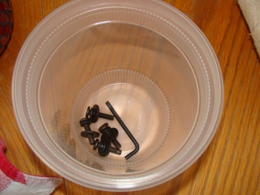 HINT:  Keep all of the nuts and bolts in a container so that you can easily find them later.