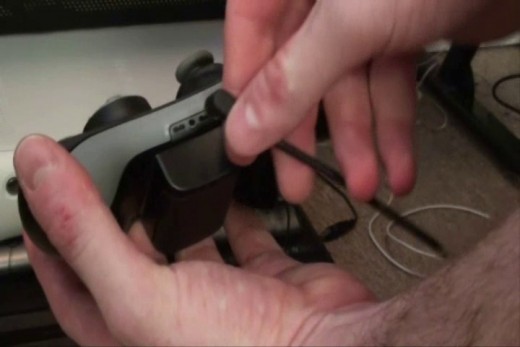 Plug the other end of the cable to the headset output on the bottom of the Xbox 360 controller.
