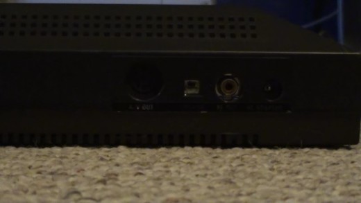 The back right side of the Sega Master System console where you connect the AC power cable, RF cable and switch the output channel.