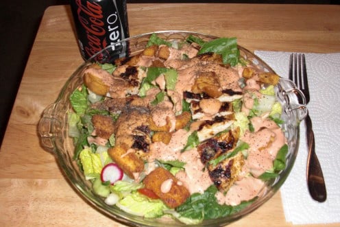 Here is the finished salad!  A hot grilled chicken breast served on top of an ice cold garden salad with your favorite dressing!