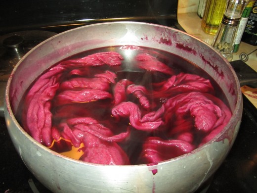 Simmering the rinsed mordanted scarf in the dyebath.