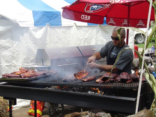 A Chef Cooking Ribs At A Rib Cook Off Contest.