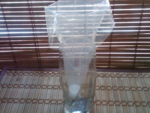 Bag in glass with top cuffed over about 3".