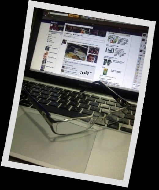 Facebooking with my new pair of glasses~