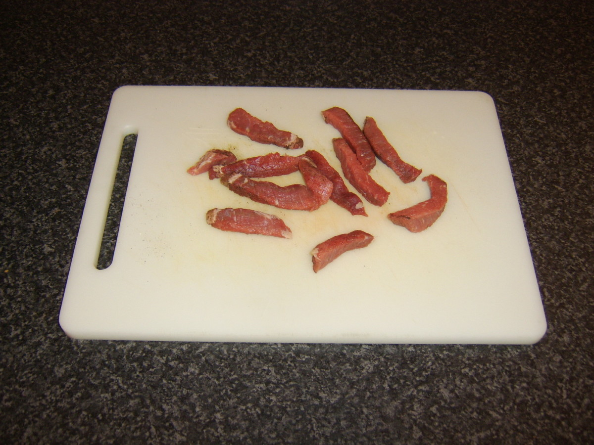 Pounded steak is cut in to strips for stir frying