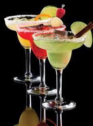 There are many versions to the basic margarita recipe.  Shown here are mango, strawberry and the ever popular classic margarita.