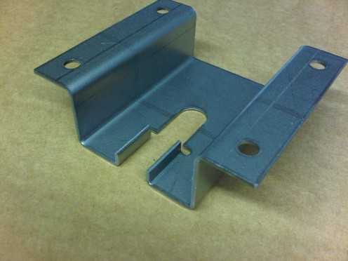Mild steel sheet metal brackets used on top of a mild steel speaker cabinet.
