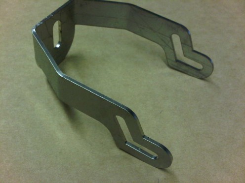 Stainless steel laser cut brackets for medical equipment.