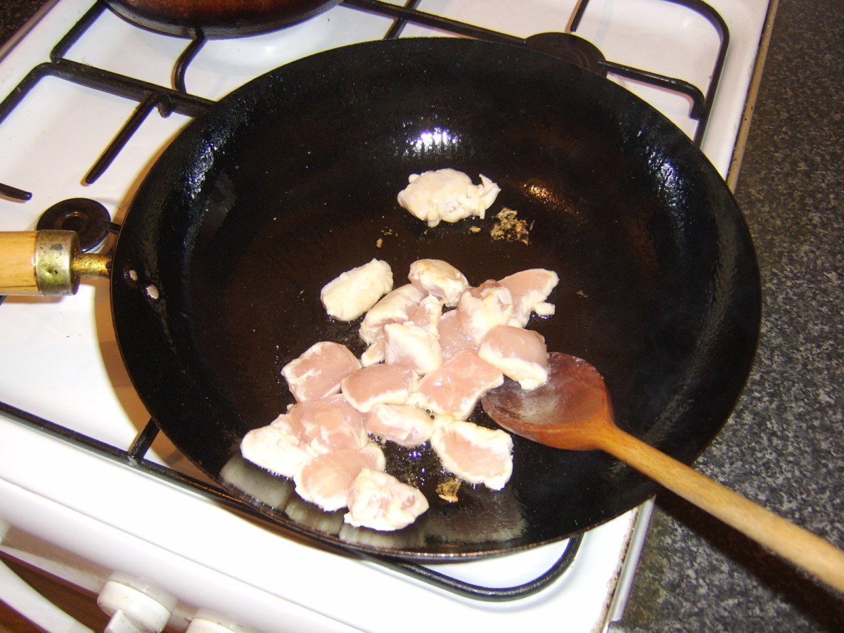 Sealing the chicken in a wok