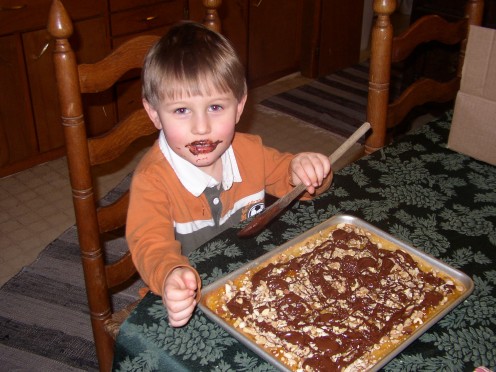 Michael thinks Apricot Cookie Bars with Chocolate Drizzle were fun!  Especially licking the spoon!  Michael was only 3 when this picture was taken, but he made the cookies!  And enjoyed them!  