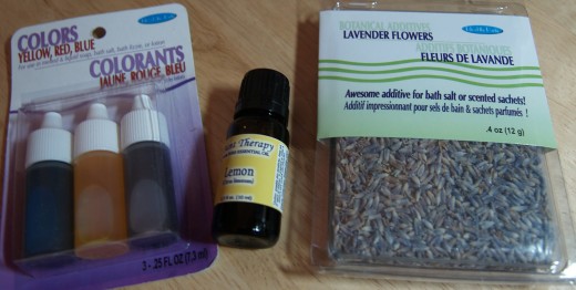 Colorants, essentail oil, and lavender flowers (a botanical additive) used by the author in the making of bath salts.