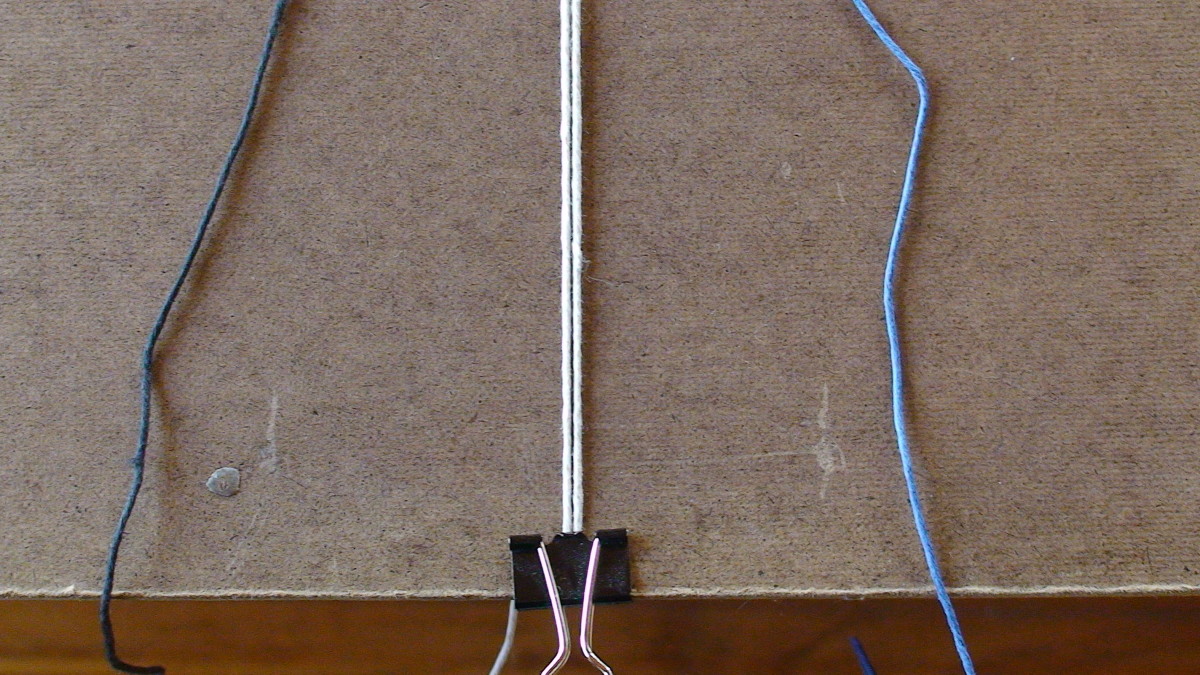 Step 2  Attach anchor cords to clip board with binder clip.