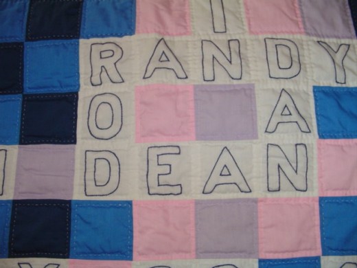 Closeup of names on crossword puzzle quilt