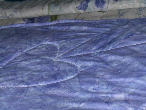 Quillow Quilt Design was the same as the design of the pillow top in a very large scale with the same type of outline stitch.