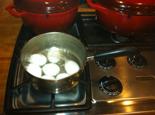 Boiling the eggs for 15 minutes to reach hard-boil