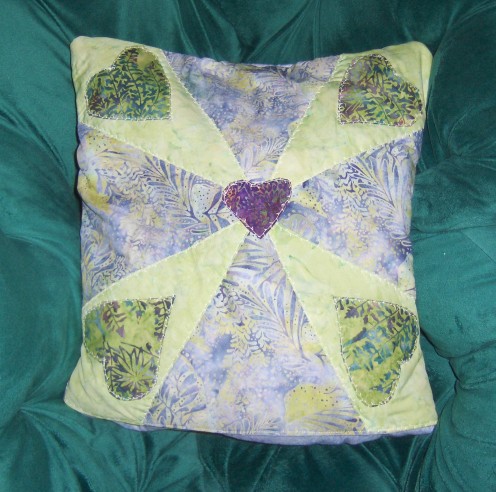 Finished quillow folded into a pillow The pieced pillow top is flipped to the  outside and you have a beautiful pillow.