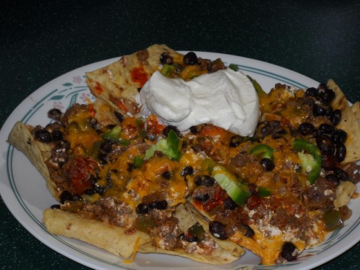 Top some chips with bean dip and sour cream, it's like instant nacho's.