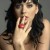 Katy Perry with two fingers in mouth 