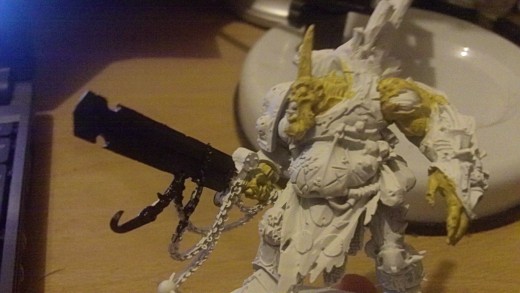 Paint the sword and chains with black acrylic paint.
