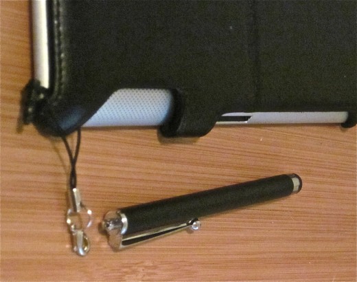 The optional iPhone strap can be looped securely under one corner of a SimplyMac smart case. There's a clasp like a necklace clasp, but sturdier, that lets you detach the stylus.