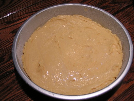 Press cake mixture in pan.
