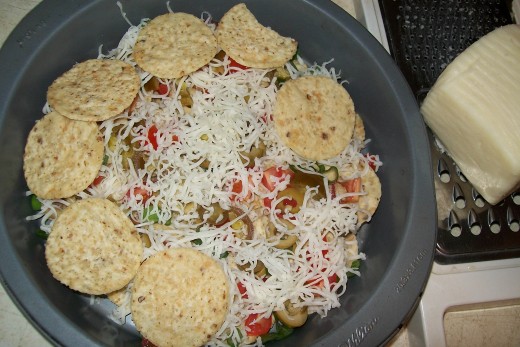 Another layer of corn chips will help balance out the middle layer of ingredients, plus make the nachos go further.