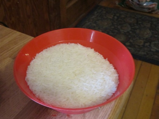This is an average sized bowl and is half-filled with uncooked rice. When rice is cooked it expands as it absorbs the water and nearly triples in size from the original grain. This half-full bowl of uncooked rice is enough to feed 4-6 people!