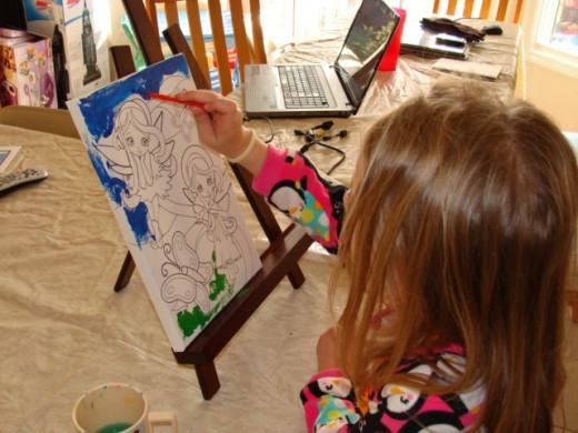 Painting on a canvas is great fun!