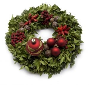 Look at manmade and natural decorations on this wreath - the natural ones look better!