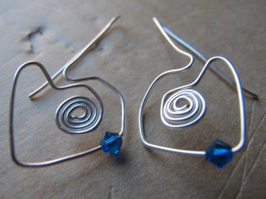 For these earrings, I actually built the hearts around the spirals.