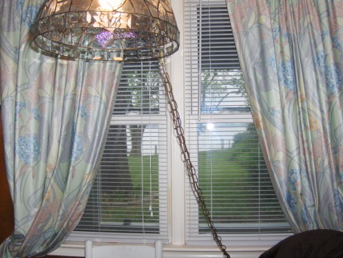 This swag glass lamp traveled through many houses I put on the market, places I lived.. I had it for 30 years.  Note this great view out the window