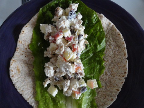 Chicken salad and lettuce in a whole wheat wrap