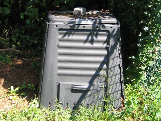 Plastic compost bin with accessible door in front