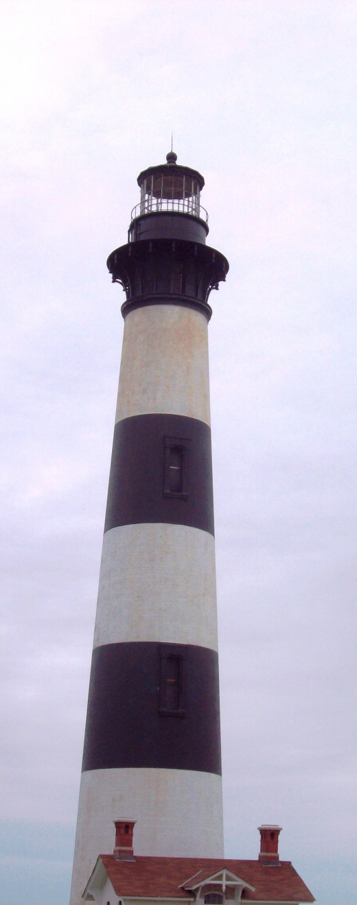 Exterior of Bodie Island Lighthouse.  The day was cloudy and windy and there was light renovation going on at the entrance. But the lighthouse is spectacular.