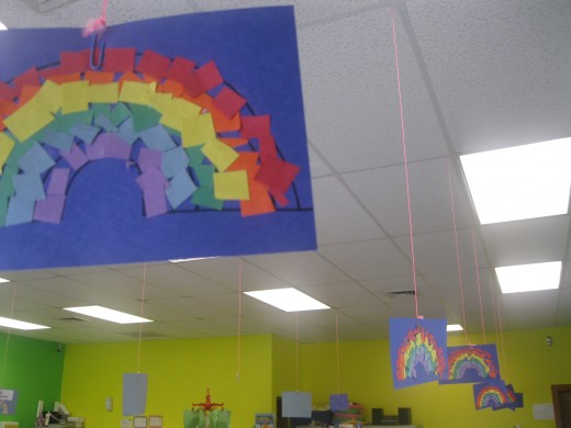 I love the Construction Paper rainbows displayed hanging from the ceiling. 