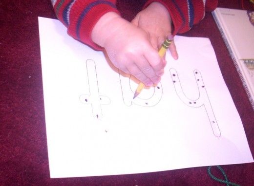 My son doing his "worksheet."